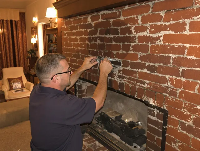 Tamiami Chimney Sweep expert fixing a fireplace in Tamiami, FL